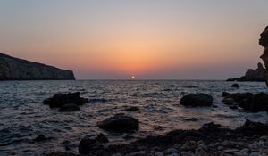 Preview wallpaper sea, water, stones, sun, sunset