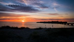 Preview wallpaper sea, water, sun, clouds, sunset, dark