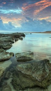 Preview wallpaper sea, water, transparent, coast, bottom, stones, decline, sky, shades