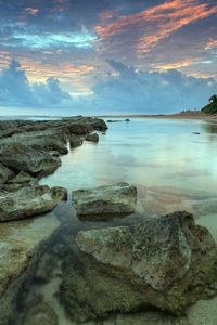 Preview wallpaper sea, water, transparent, coast, bottom, stones, decline, sky, shades