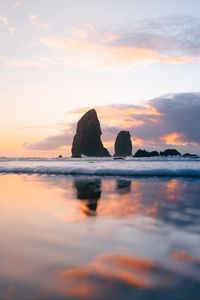 Preview wallpaper sea, wave, rocks, sunset, water