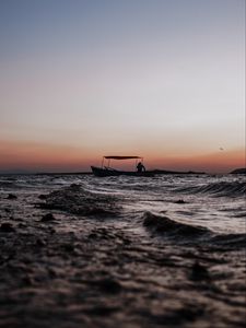 Preview wallpaper sea, waves, boat, silhouette, dark, dusk