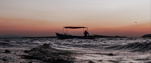 Preview wallpaper sea, waves, boat, silhouette, dark, dusk