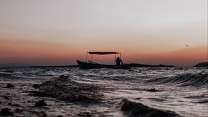 Preview wallpaper sea, waves, boat, silhouette, dark, dusk