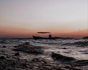 Preview wallpaper sea, waves, boat, silhouette, dark, dusk