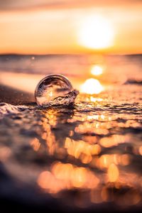 Preview wallpaper sea, waves, bubble, foam, sunset