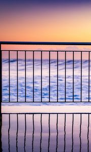 Preview wallpaper sea, waves, fence, stripes, reflection, twilight