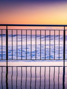 Preview wallpaper sea, waves, fence, stripes, reflection, twilight
