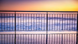 Preview wallpaper sea, waves, fence, stripes, reflection, twilight