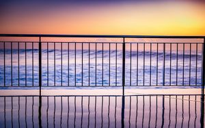 Preview wallpaper sea, waves, fence, stripes, reflection, twilight