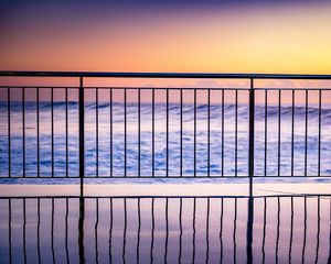 Preview wallpaper sea, waves, fence, stripes, reflection, twilight