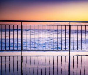 Preview wallpaper sea, waves, fence, stripes, reflection, twilight