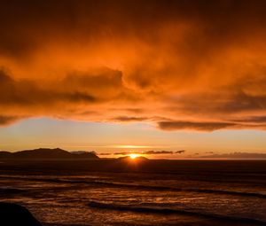 Preview wallpaper sea, waves, hills, sunset, clouds