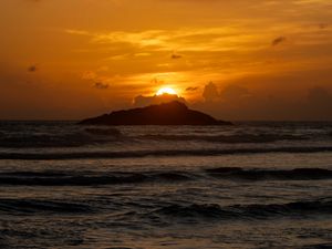 Preview wallpaper sea, waves, mountains, sunset, clouds, landscape