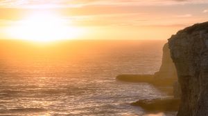 Preview wallpaper sea, waves, rocks, sunset