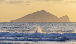 Preview wallpaper sea, waves, splashes, mountain, silhouette, landscape