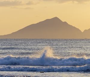 Preview wallpaper sea, waves, splashes, mountain, silhouette, landscape