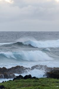 Preview wallpaper sea, waves, splashes, stones, grass, sky, nature