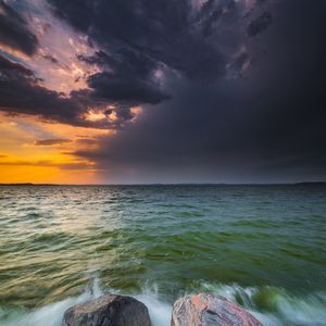 Preview wallpaper sea, waves, stones, sunset, landscape
