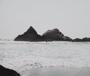 Preview wallpaper sea, waves, surfer, rocks, beach