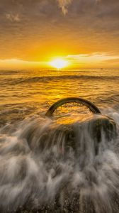 Preview wallpaper sea, waves, wheel, sunset