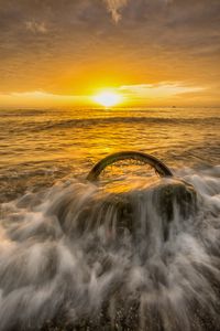 Preview wallpaper sea, waves, wheel, sunset