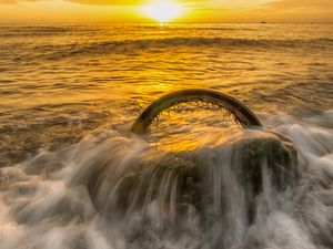 Preview wallpaper sea, waves, wheel, sunset