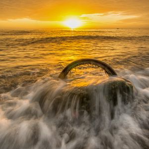 Preview wallpaper sea, waves, wheel, sunset