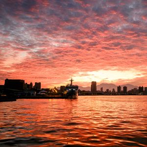 Preview wallpaper ship, buildings, sea, sunset, evening