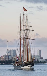 Preview wallpaper ship, city, sea, sky, clouds