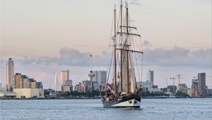 Preview wallpaper ship, city, sea, sky, clouds