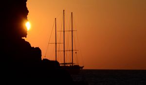 Preview wallpaper ship, masts, rock, evening