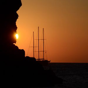 Preview wallpaper ship, masts, rock, evening