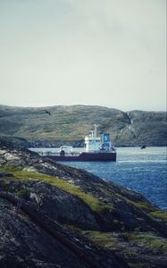 Preview wallpaper ship, sea, coast, hills, rocks