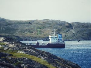 Preview wallpaper ship, sea, coast, hills, rocks