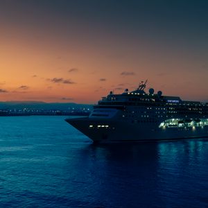 Preview wallpaper ship, sea, lights, evening
