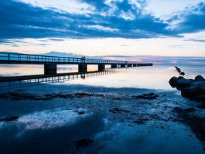 Preview wallpaper shore, bridge, silhouettes, sea, water, twilight