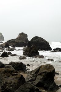 Preview wallpaper shore, rocks, waves, water, sand, sky, nature