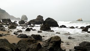 Preview wallpaper shore, rocks, waves, water, sand, sky, nature