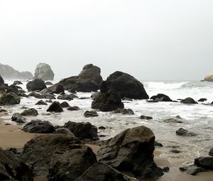 Preview wallpaper shore, rocks, waves, water, sand, sky, nature