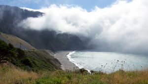 Preview wallpaper shore, sea, fog, mountain, grass