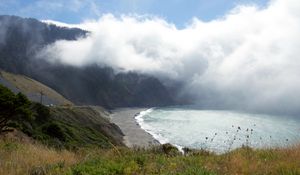 Preview wallpaper shore, sea, fog, mountain, grass