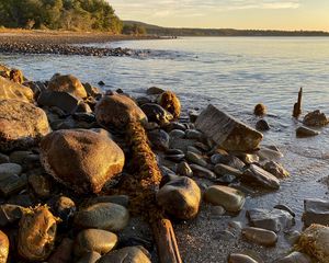 Preview wallpaper shore, stones, sea, horizon, landscape