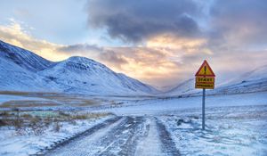 Preview wallpaper sign, prevention, mountains, road, snow, protectors, sky, clouds