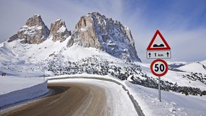 Preview wallpaper sign, road, restriction, mountains, snow, winter, turn, 50