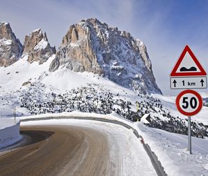 Preview wallpaper sign, road, restriction, mountains, snow, winter, turn, 50