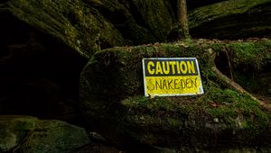 Preview wallpaper sign, warning, words, stone, moss