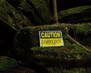 Preview wallpaper sign, warning, words, stone, moss
