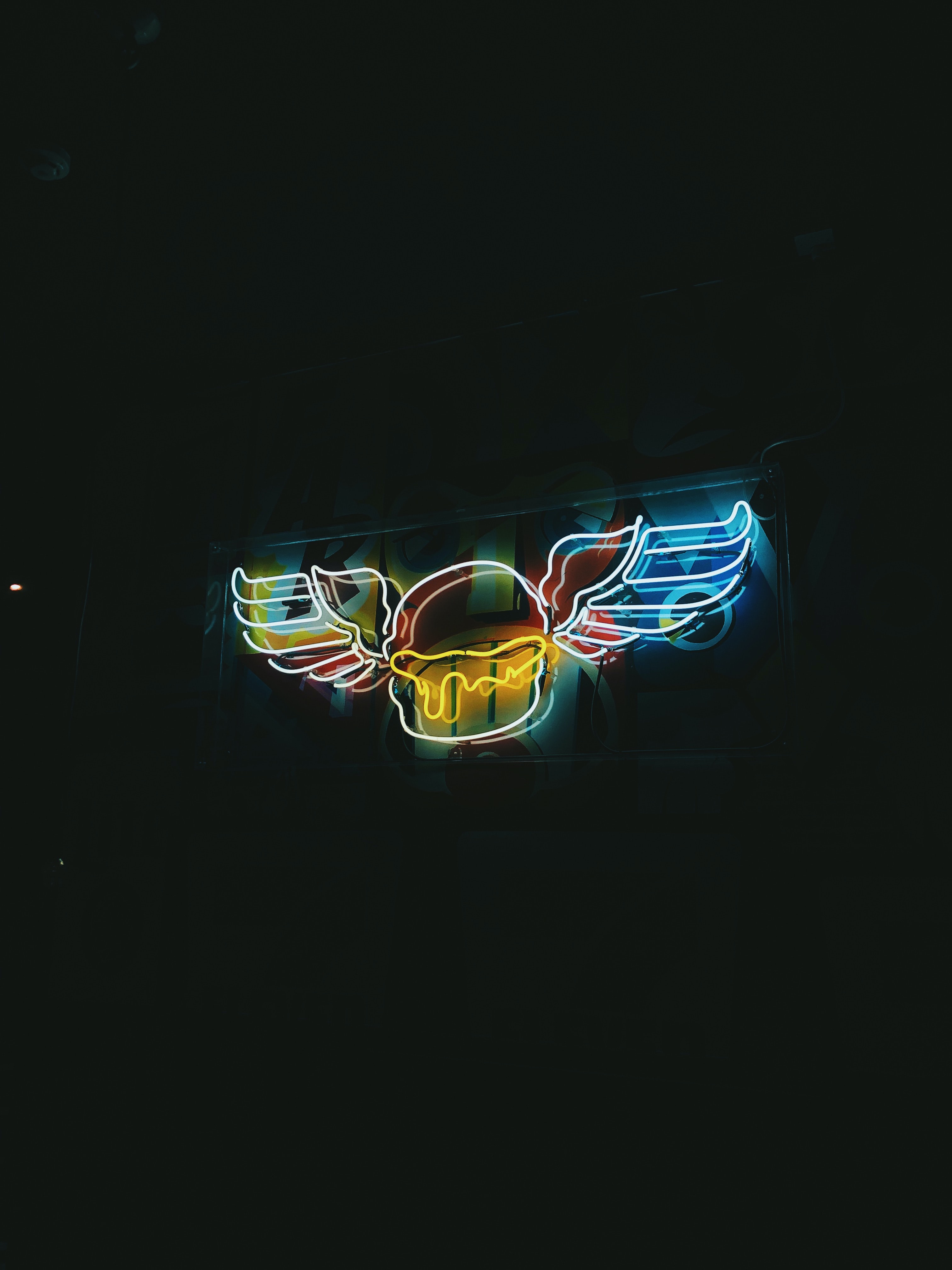 Download wallpaper 3024x4032 sign, wings, neon, backlight, night hd