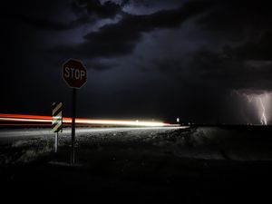 Preview wallpaper signs, road, night, dark, thunderstorm